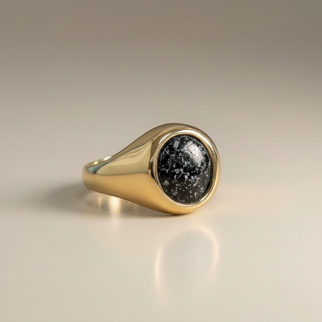 Ashes In Jewellery gents oval traditional signet ring with black speckled stone inlay, crafted from gold.