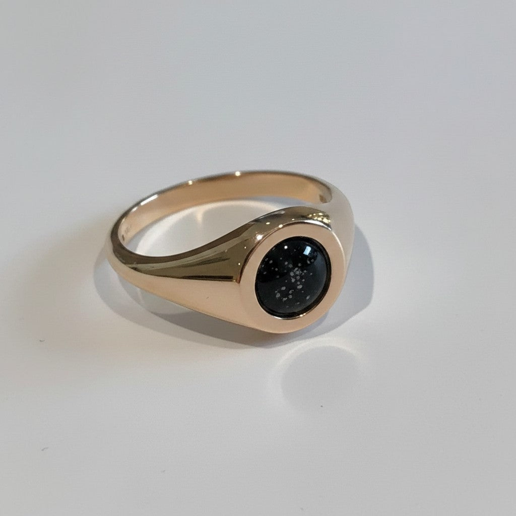 Ashes In Jewellery 14k yellow gold signet ring with red and white speckled cremation ash inlay.