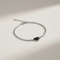 Ashes In Jewellery gold heart memorial bracelet with black speckled inlay, adjustable chain.