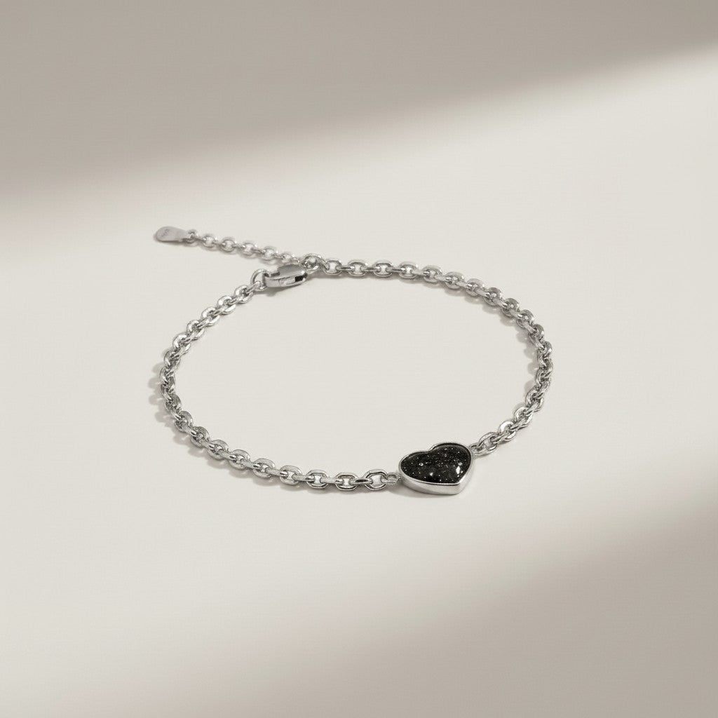 Ashes In Jewellery gold heart memorial bracelet with black speckled inlay, adjustable chain.