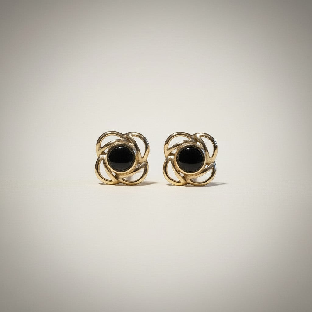 Ashes In Jewellery gold-tone Celtic knot stud earrings with deep red center stone.