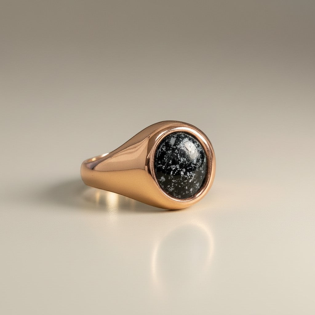 Ashes In Jewellery gold oval signet ring with black speckled stone, suitable for engraving.