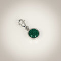 Ashes In Jewellery silver-tone round charm with red glitter cremation ash and lobster clasp.