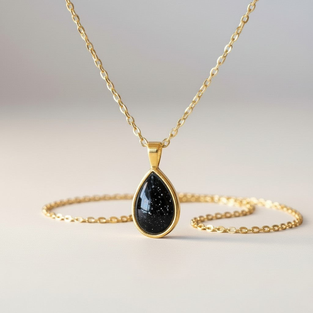 Ashes In Jewellery teardrop pendant necklace with black speckled stone and silver-tone bezel on a delicate chain.