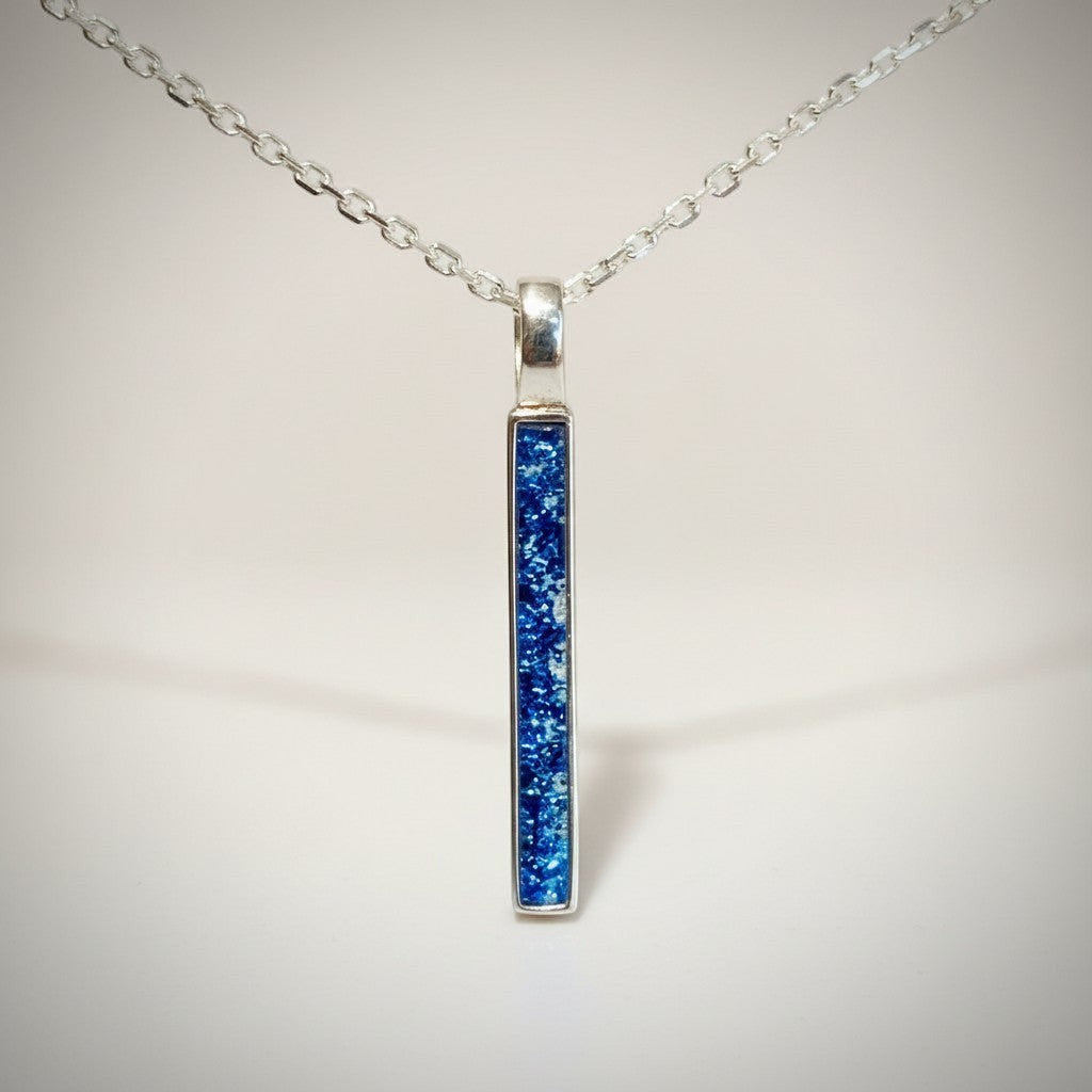 Ashes In Jewellery sterling silver bar pendant necklace with blue glitter resin inlay on a delicate silver chain.