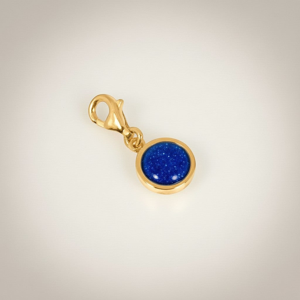 Ashes In Jewellery silver-tone round charm with blue glitter inlay and lobster clasp.