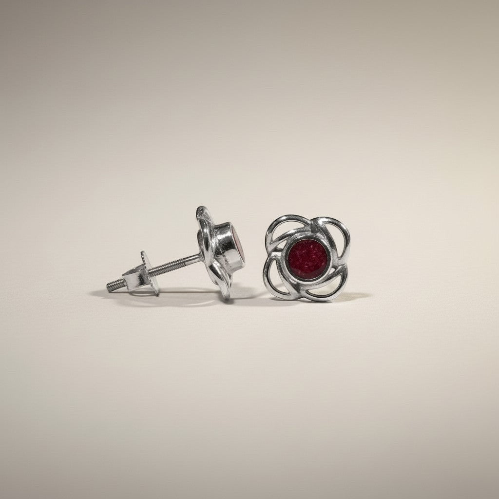 Ashes In Jewellery gold-tone stud earrings with deep red stone and swirling metalwork. Screw-back closure.