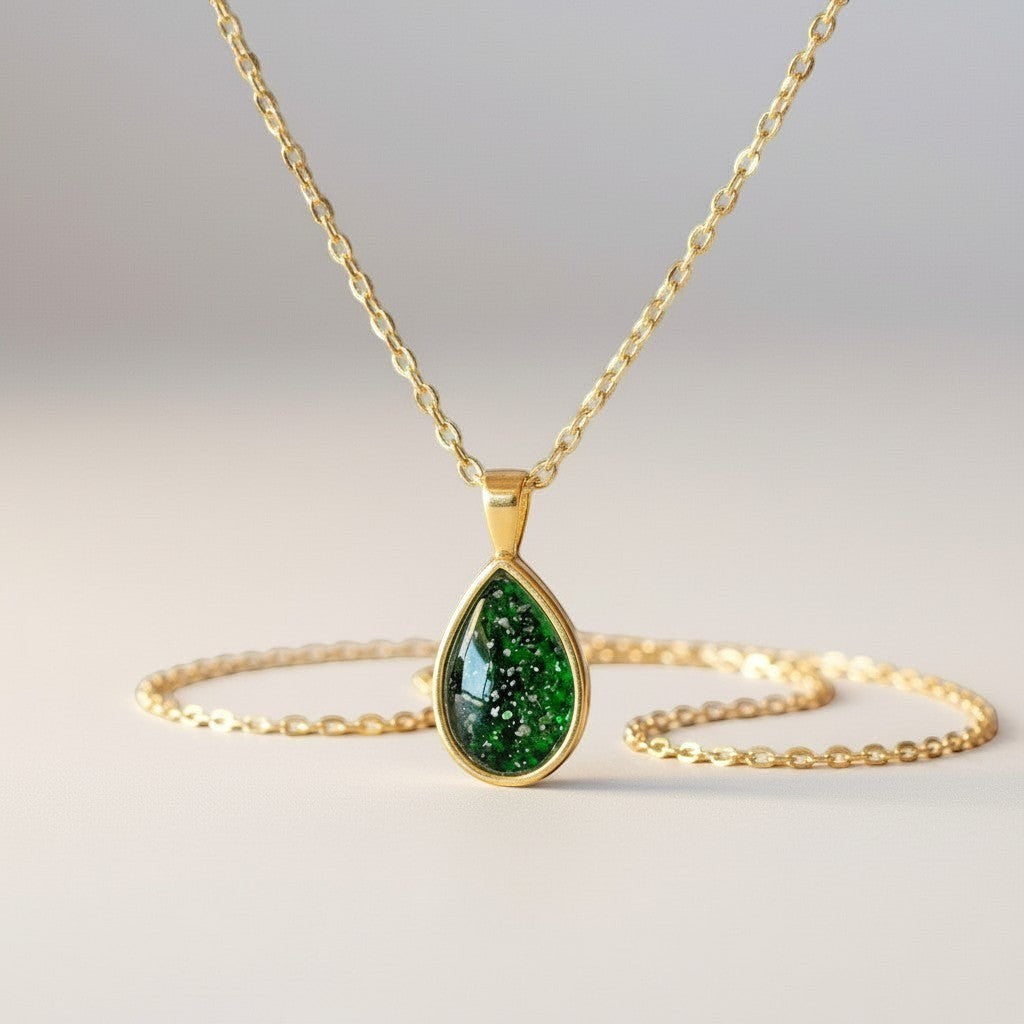 Ashes In Jewellery teardrop pendant necklace with green speckled stone and silver-tone chain.
