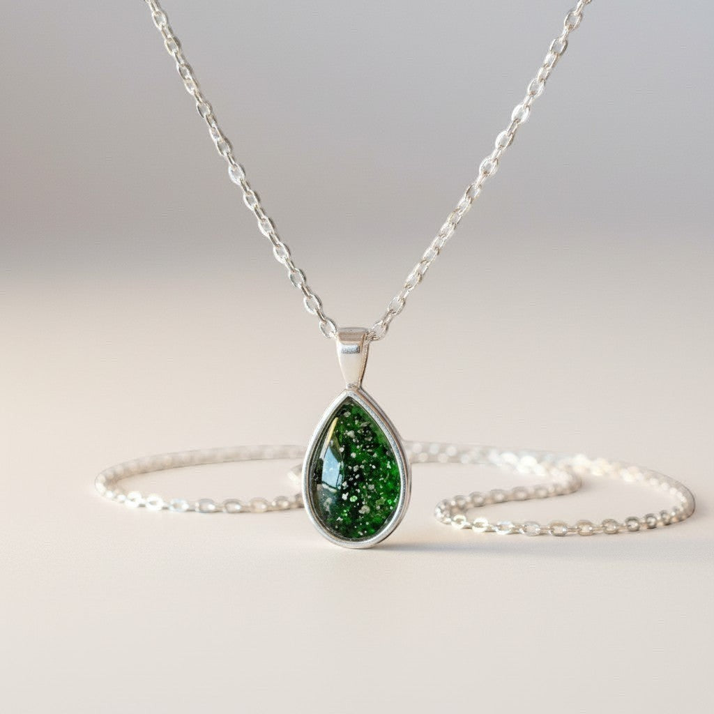 Ashes In Jewellery teardrop pendant necklace with a green speckled stone in a silver-tone bezel and delicate chain.