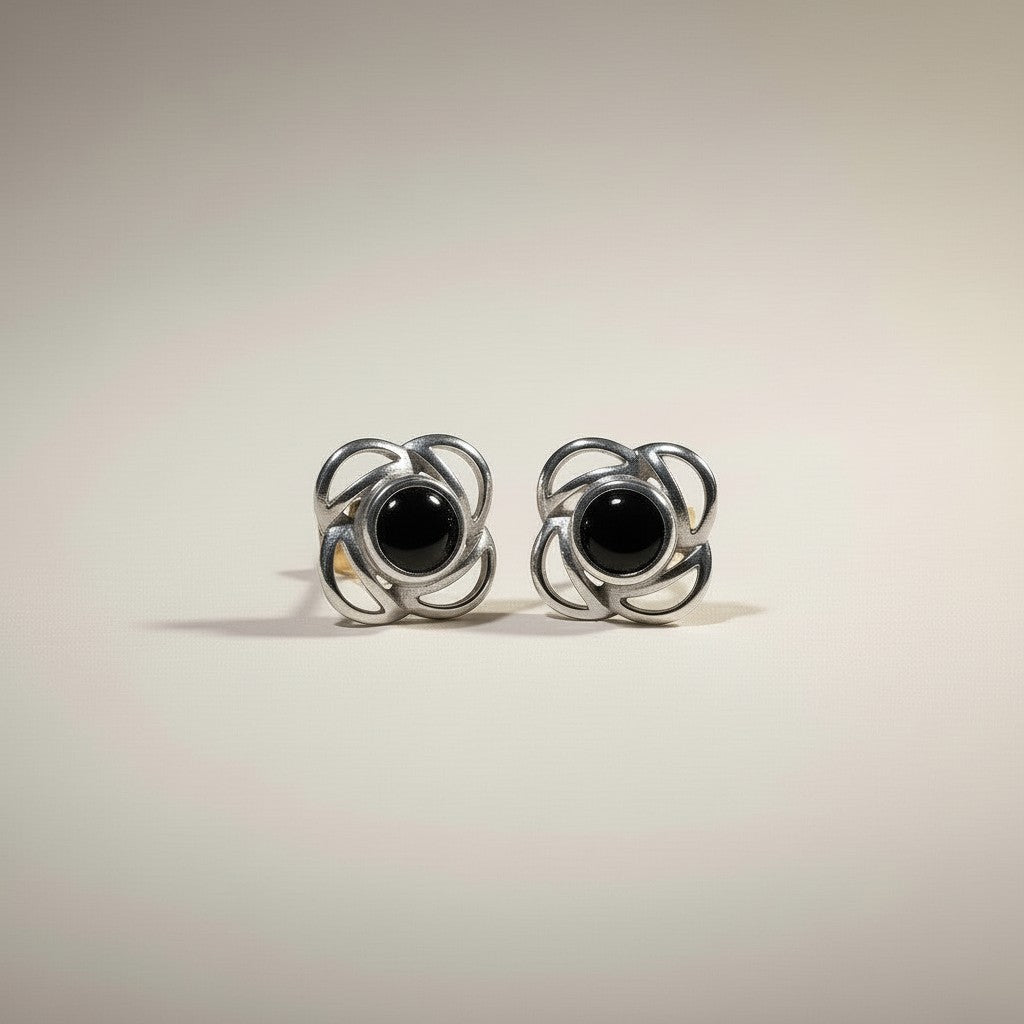 Ashes In Jewellery silver-tone Celtic knot stud earrings with deep blue stones. Flower-inspired design.